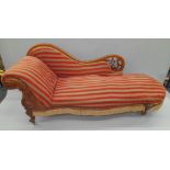 A Victorian upholstered mahogany chaise lounge. Approximately 190 cm long.