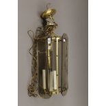 A glass and brass lantern. 60 cm high.