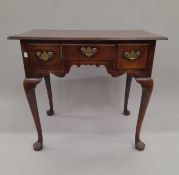 A George III mahogany low boy. 81 cm wide.