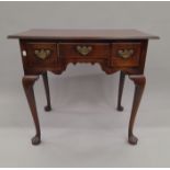 A George III mahogany low boy. 81 cm wide.