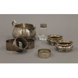 A silver cream jug, napkin rings and two salts. The former 12.5 cm long. 198.9 grammes.