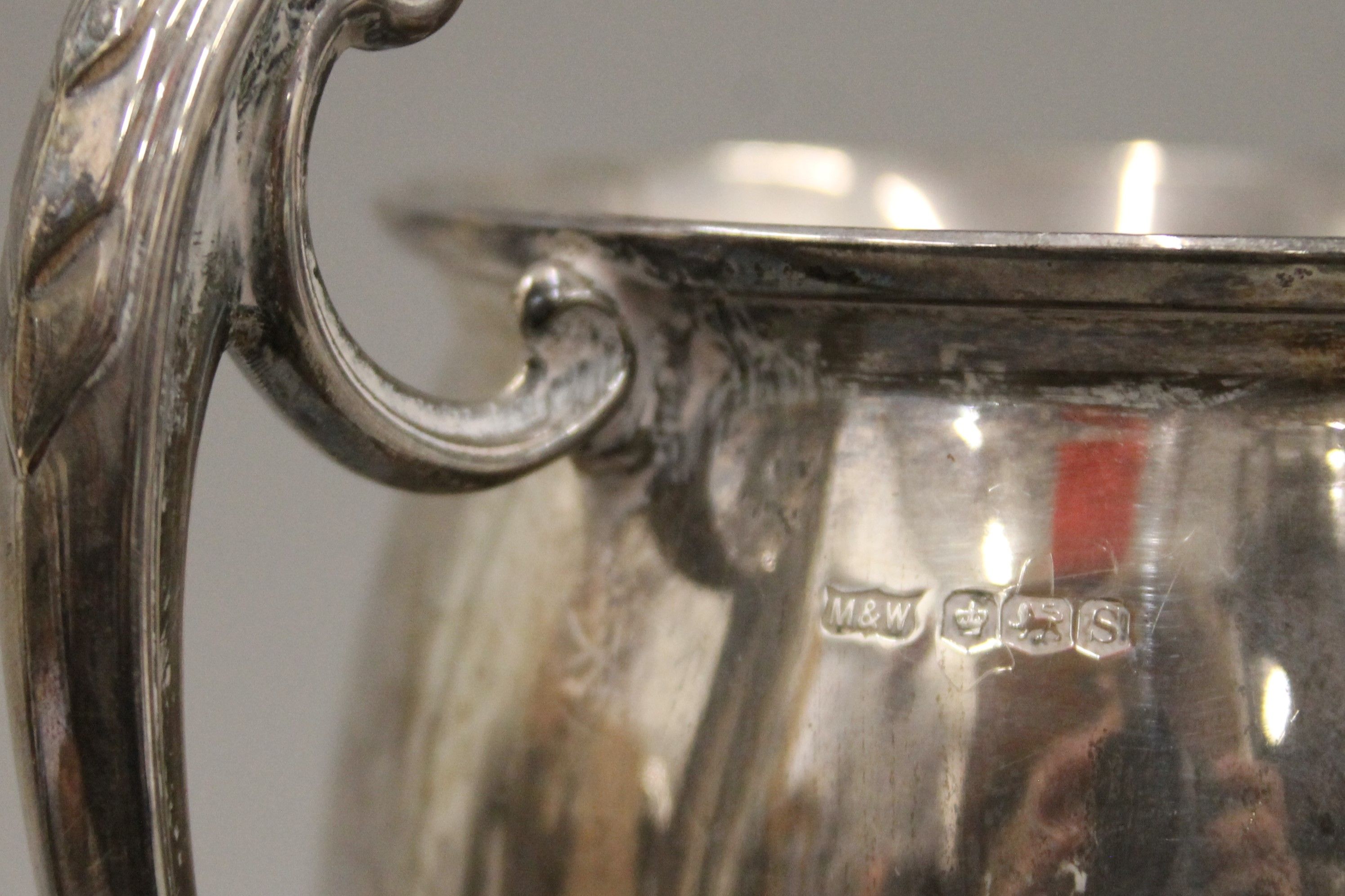 A silver twin handled trophy cup on stand. 25 cm high. 580.1 grammes total weight including base. - Image 6 of 6