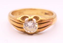 An 18 ct gold diamond solitaire ring. The diamond spreading between .5 and 0.75 carat. Ring size Q.