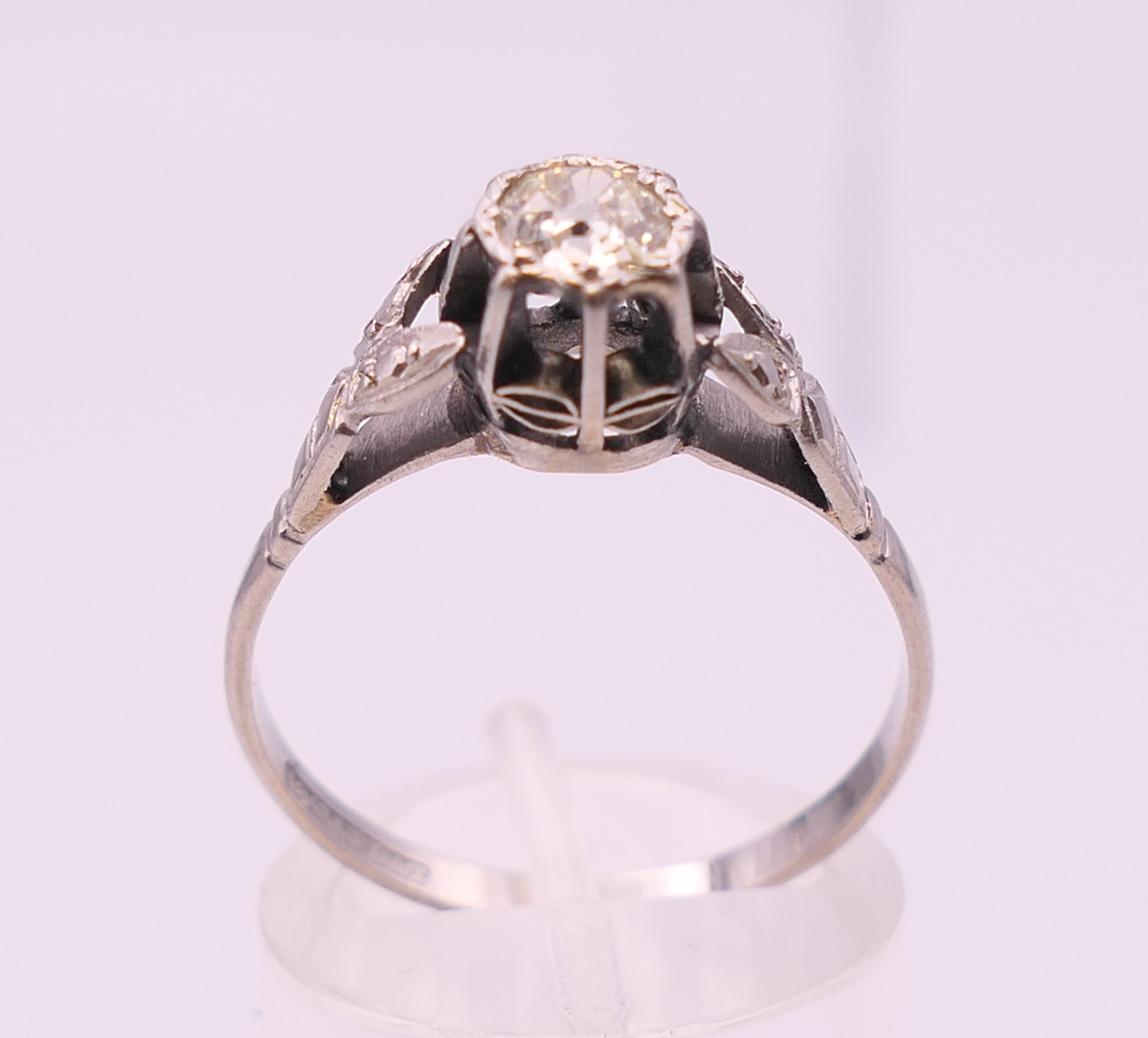 An 18 ct white gold and platinum diamond solitaire ring. The central approximately .5 carat. - Image 4 of 6