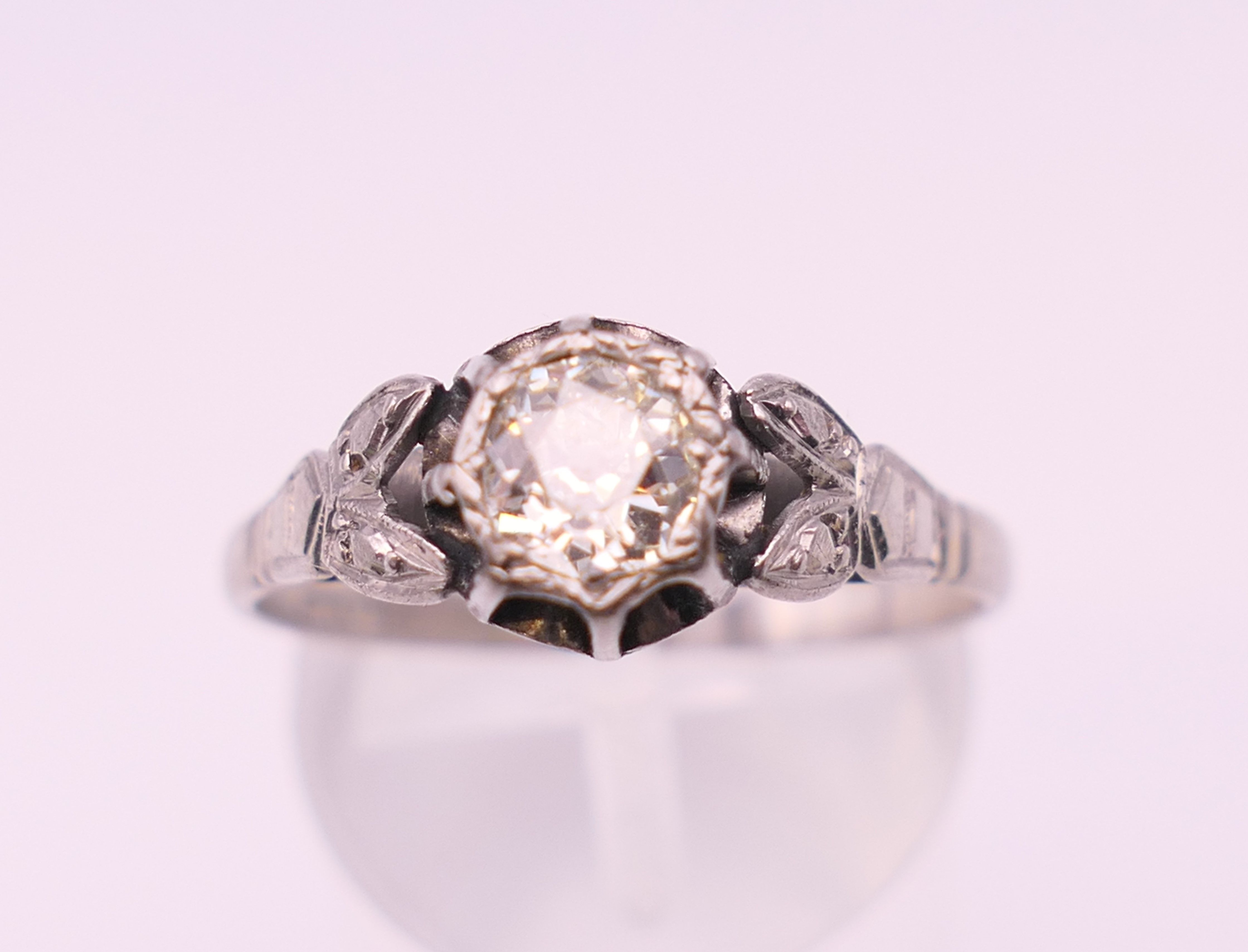 An 18 ct white gold and platinum diamond solitaire ring. The central approximately .5 carat. - Image 2 of 6