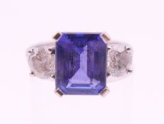 An 18 ct white gold, diamond and tanzanite ring. The tanzanite approximately 3.