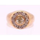 A 14 K gold and diamond target ring. The central stone approximately .25 carat. Ring size N.