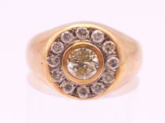 A 14 K gold and diamond target ring. The central stone approximately .25 carat. Ring size N.