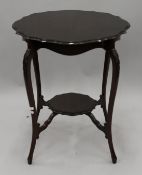 An Edwardian mahogany side table. 58 cm diameter.