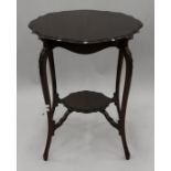 An Edwardian mahogany side table. 58 cm diameter.