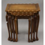 A nest of four Eastern carved tables. 45.5 cm wide.