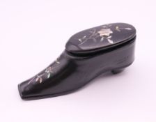 A 19th century mother-of-pearl inlaid lacquered snuff shoe. 8 cm long, 3.5 cm high.