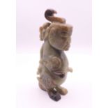 A Chinese jade mythical carving. 15 cm high.