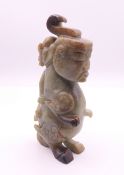 A Chinese jade mythical carving. 15 cm high.