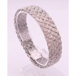 An Art Deco diamond set 18 ct white gold bracelet. 18.5 cm long. 38.9 grammes total weight.