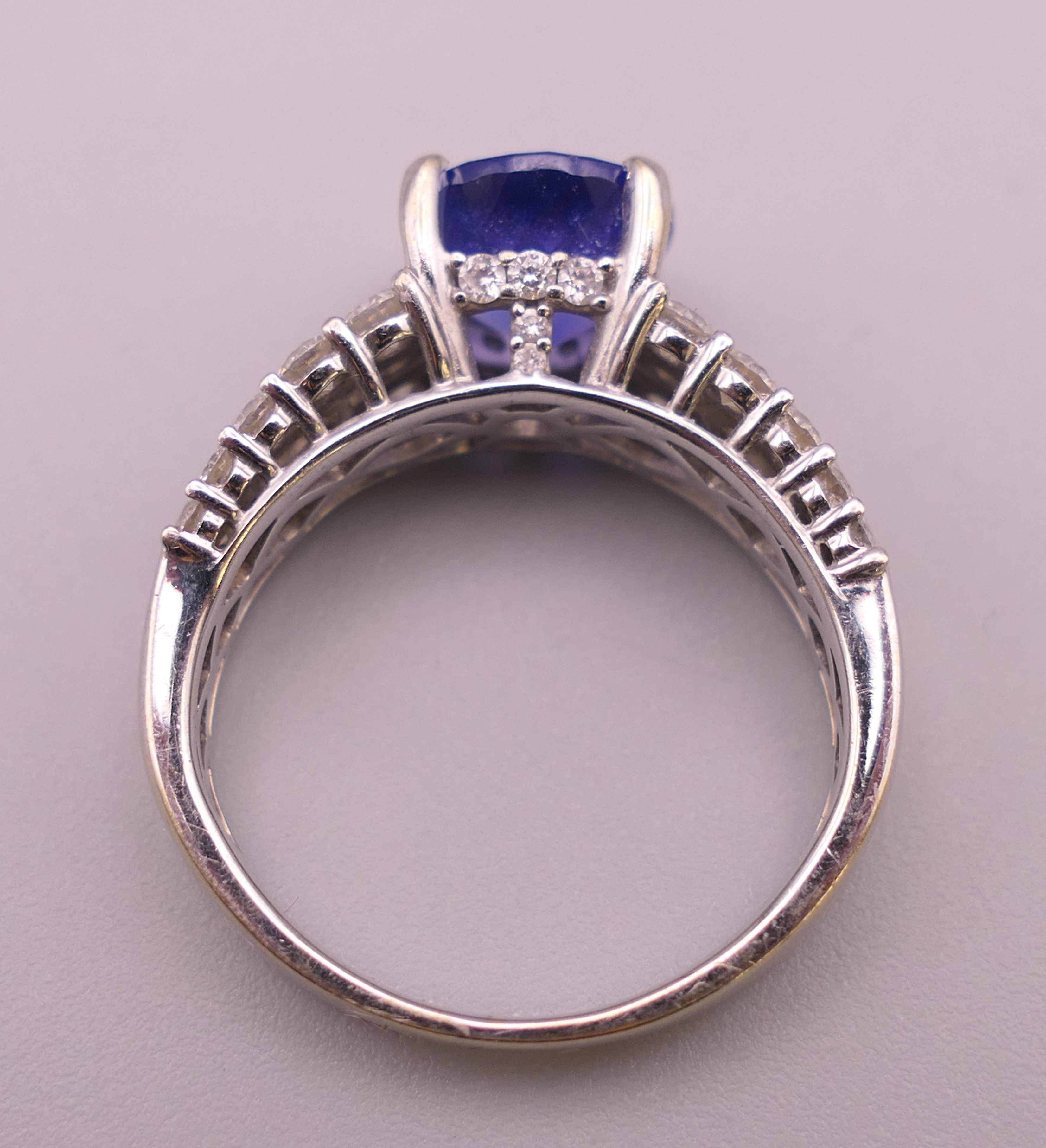 An 18 K white gold diamond and tanzanite ring; - Image 3 of 6