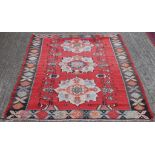 A Basra red ground runner (67 x 250 cm); together with a Kilim rug (155 x 215 cm).