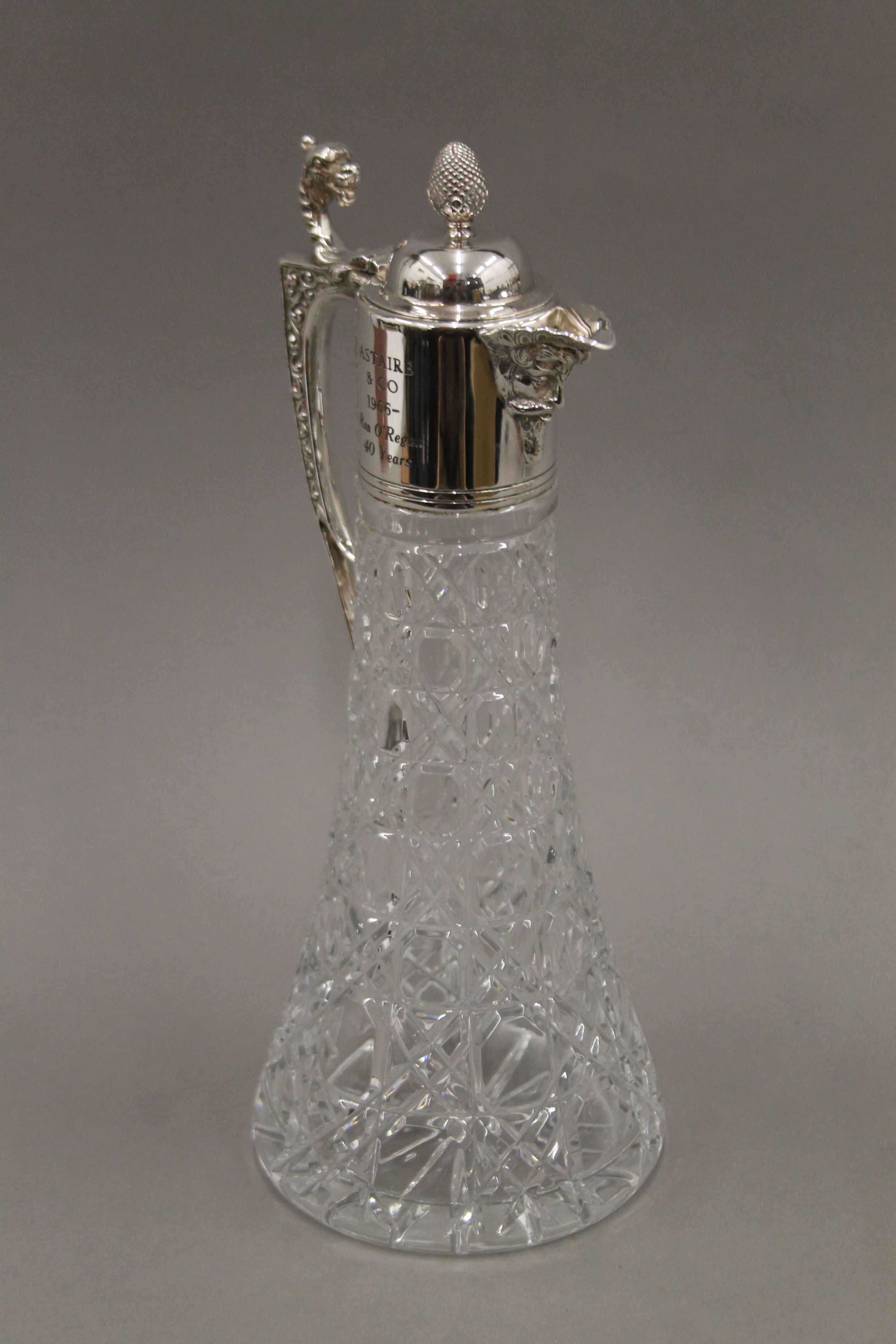 A pair of silver mounted cut glass claret jugs. 30.5 cm high. - Image 2 of 6