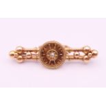 A 15 ct gold and diamond brooch. 5 cm long. 6.9 grammes total weight.