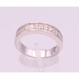 An 18 ct white gold diamond half hoop eternity ring. Ring size Q/R.