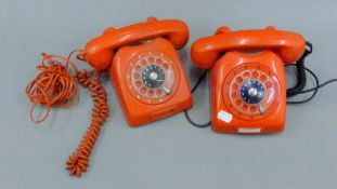 A pair of red telephones.