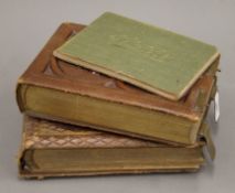 Two Victorian photograph albums and a sketch book.