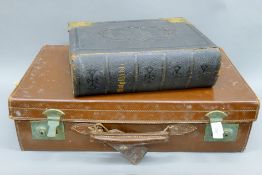 A vintage suitcase and a Bible. The case 55 cm wide.