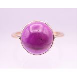 A 9 ct gold cabochon amethyst ring. Ring size N/O.