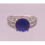 An 18 K white gold diamond and tanzanite ring;