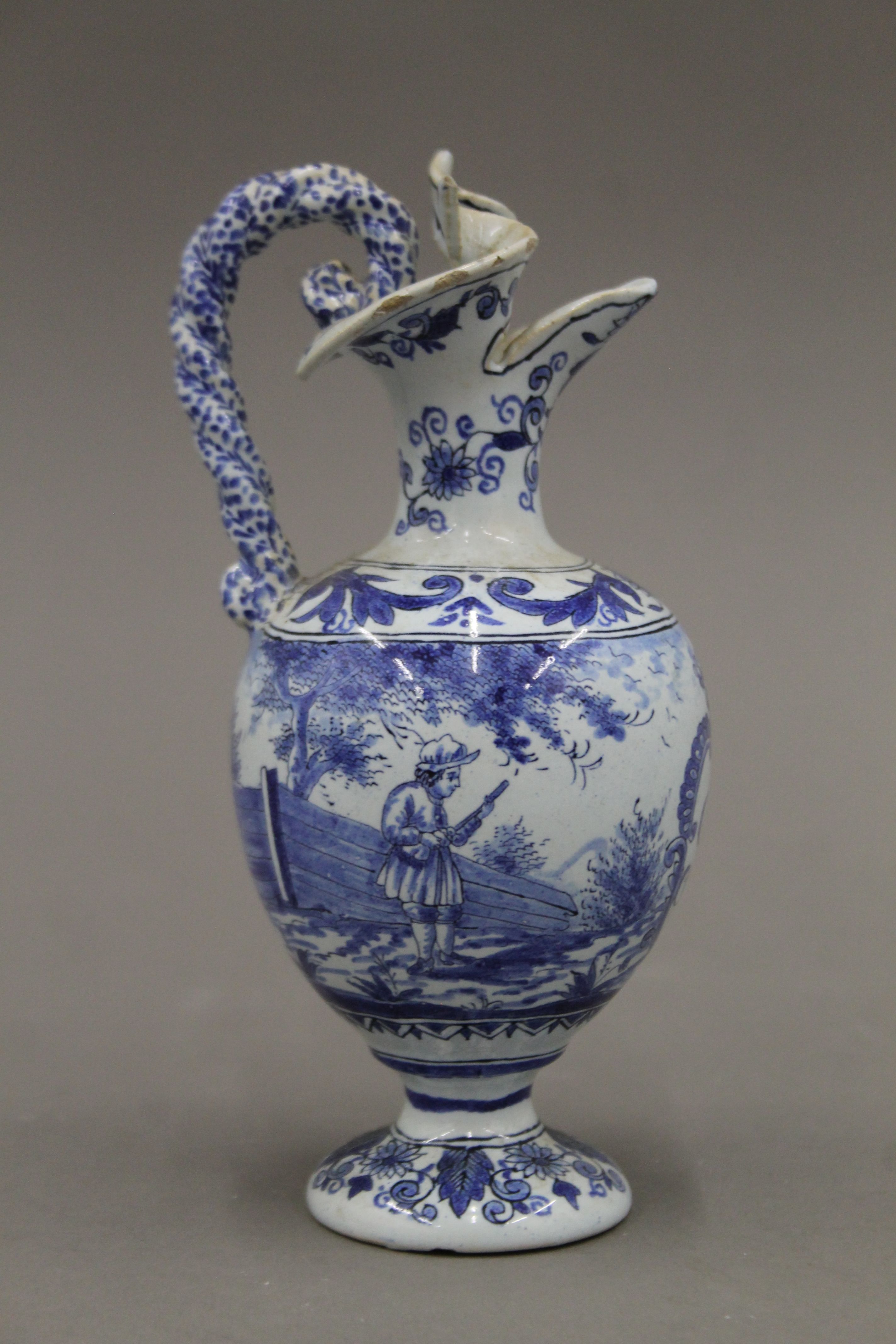 A pair of small 19th century blue and white ewers. 17.5 cm high. - Image 3 of 6