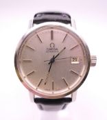 A vintage Omega Automatic wristwatch with silvered dial and date aperture.