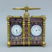 A cloisonne miniature double carriage clock/barometer. 12 cm wide.