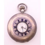 A silver pocket watch.