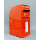 A red postbox. 60 cm high.