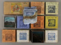 A box of boxed sets of magic lantern slides Boer War, etc.