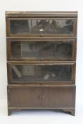 An early 20th century four stack oak bookcase by Wilton. 87 cm wide.