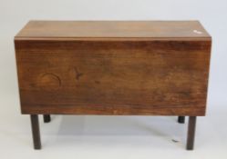 A 19th century mahogany drop leaf table. 41.5 cm wide flaps down.