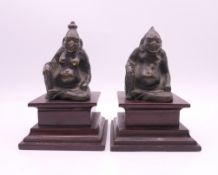 A pair of Chinese bronze figures on wooden bases. Tallest approximately 9.5 cm high including base.