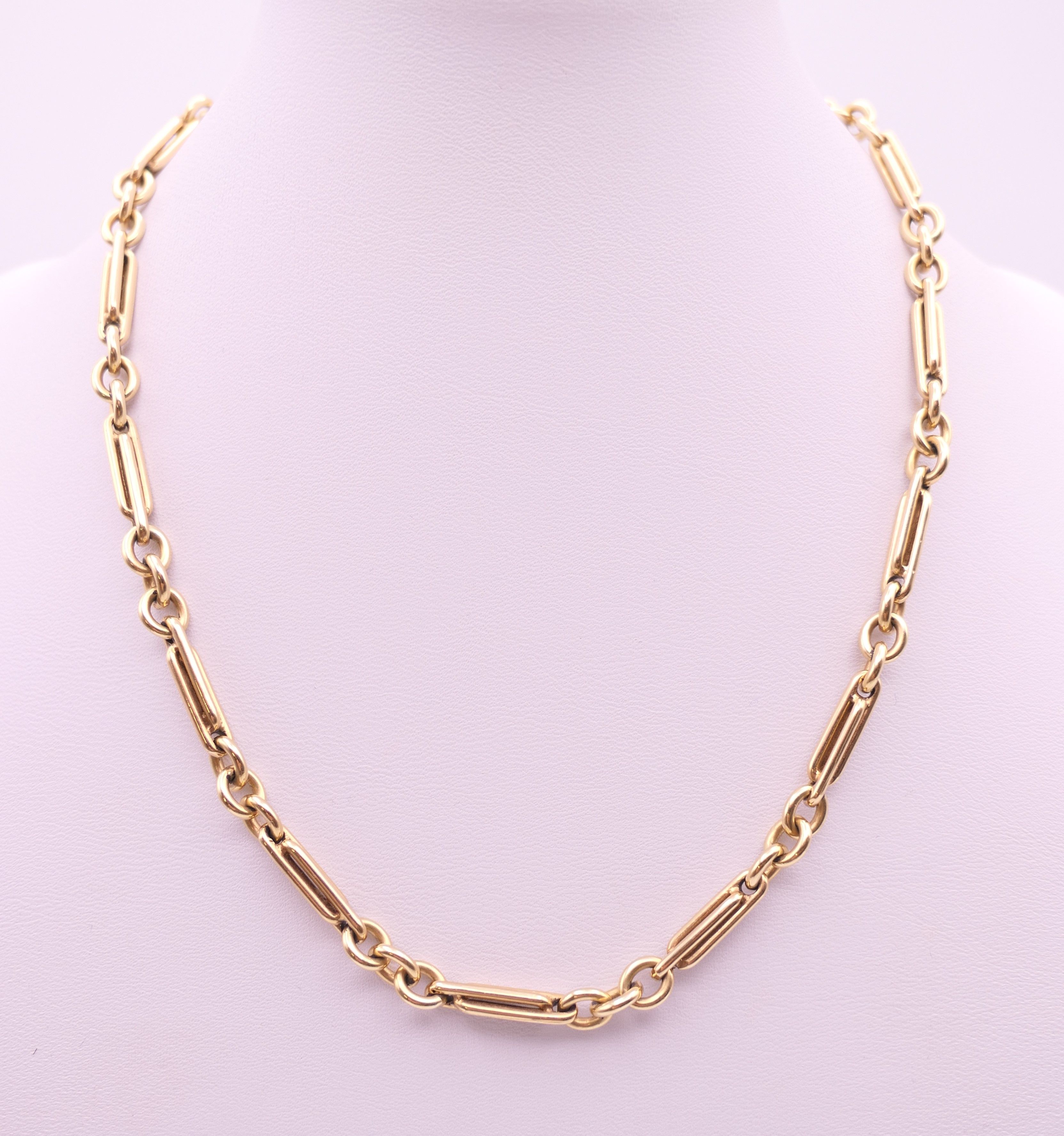 A 9 ct gold watch chain, converted to a necklace. 40.5 cm long. 29.9 grammes.