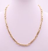 A 9 ct gold watch chain, converted to a necklace. 40.5 cm long. 29.9 grammes.