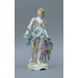 A 19th century porcelain figurine with gold anchor mark. 27 cm high.