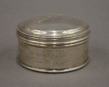 A small silver box. 6 cm diameter. 76.7 grammes.