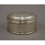 A small silver box. 6 cm diameter. 76.7 grammes.