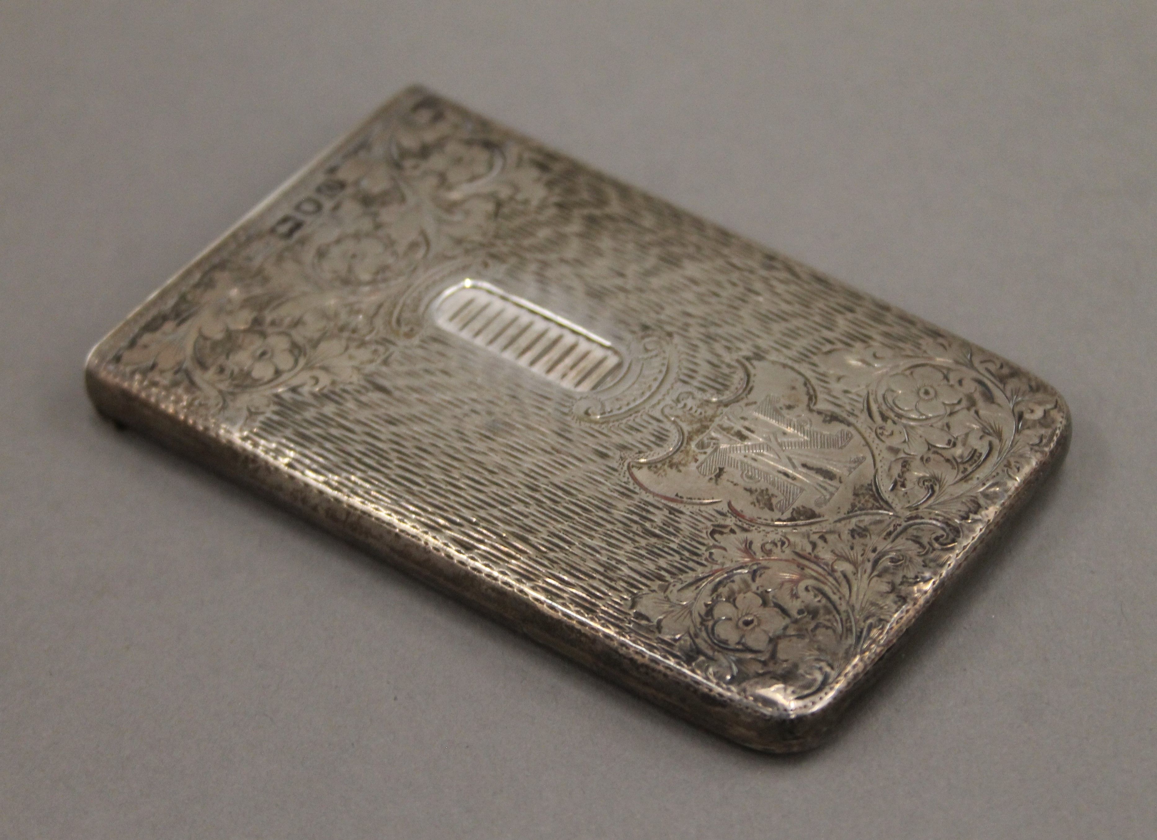 A silver card case. 5.5 cm wide. 63.4 grammes.