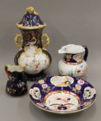 A Masons ironstone jug and bowl, another jug and a potpourri vase. The latter 39 cm high.