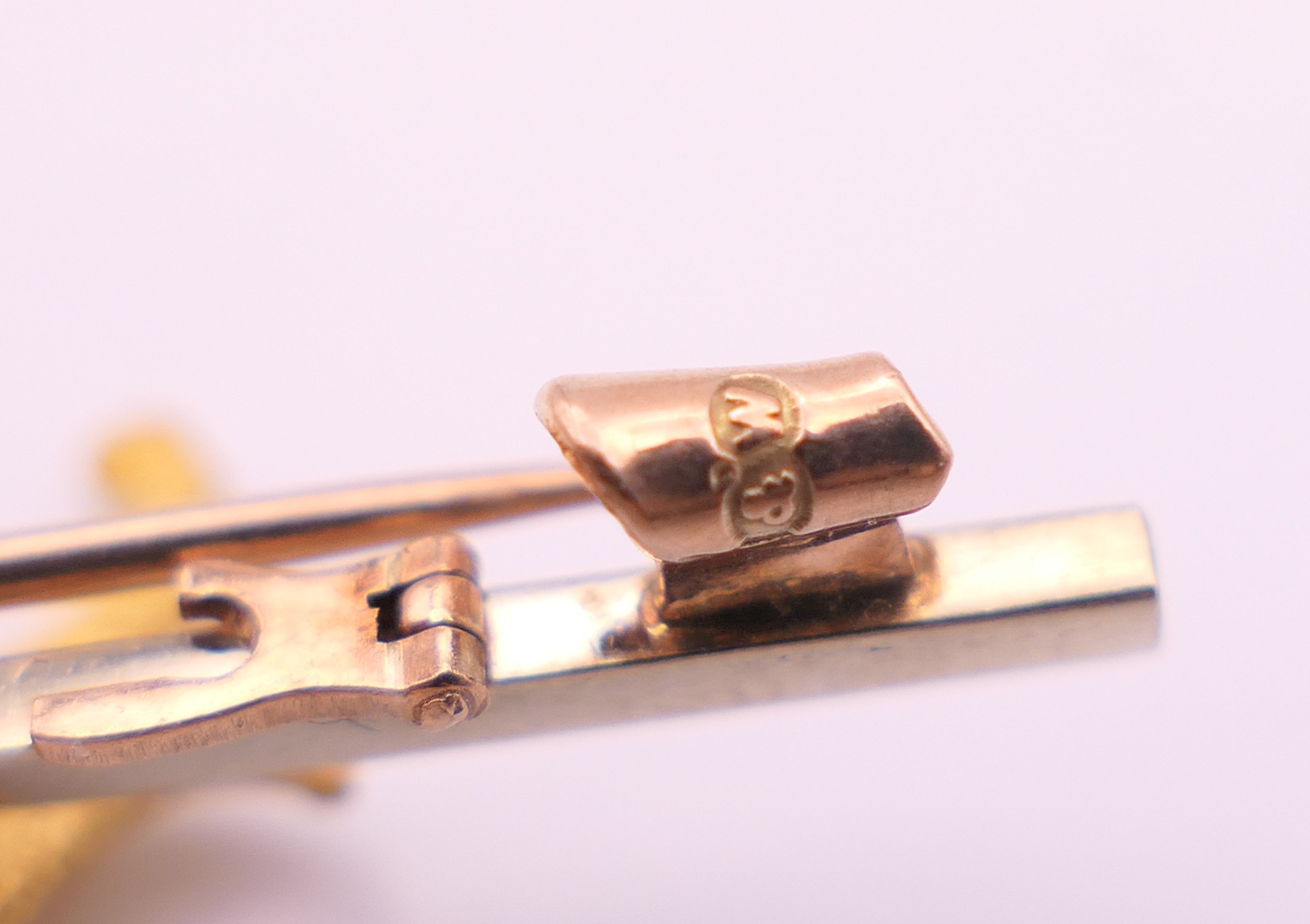 A 9 ct gold bar brooch, set with an unmarked 15 ct gold Alsatian. 5 cm long, dog 2.25 cm long. 7. - Image 6 of 9