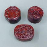 Three Chinese carved wooden boxes. The largest 7 cm wide.