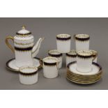 A Coalport gilt heightened blue and white coffee set.