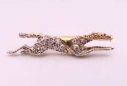 A diamond set unmarked gold racehorse brooch, possibly the horse ''Warmspun''. 3.5 cm long. 4.