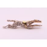 A diamond set unmarked gold racehorse brooch, possibly the horse ''Warmspun''. 3.5 cm long. 4.